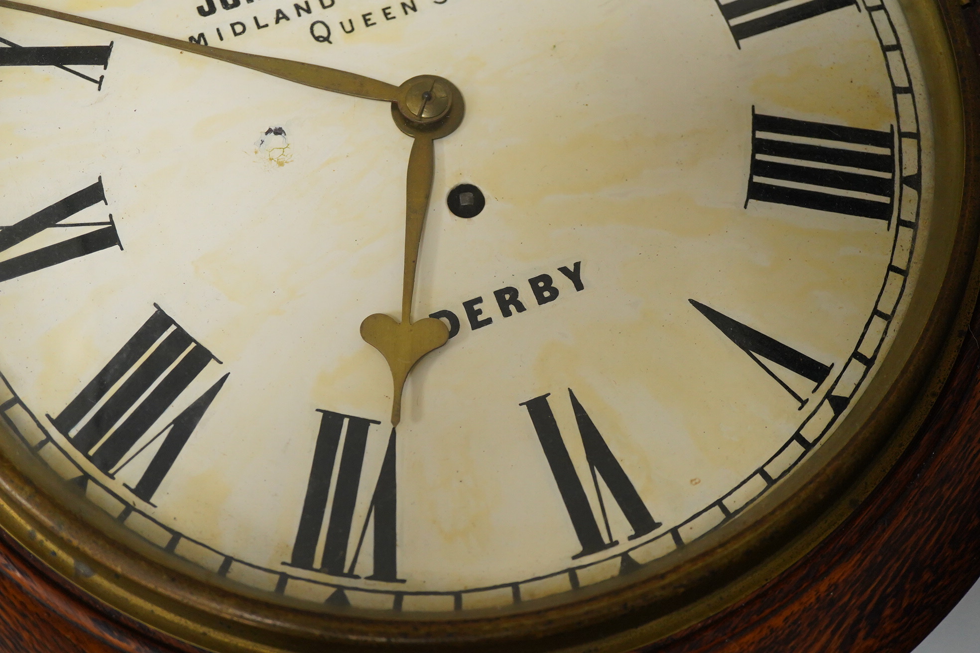 A John Smith & Sons of Derby oak wall clock, 39cm